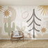 A modern room with a wooden chair and cushion is set against the Audrey Abstract Wallpaper Mural, featuring nature-inspired shapes in muted earth tones—cactus, tree, stars, and leaves—ideal for stylish kids’ room wallpaper ideas. A textured rug completes the look.