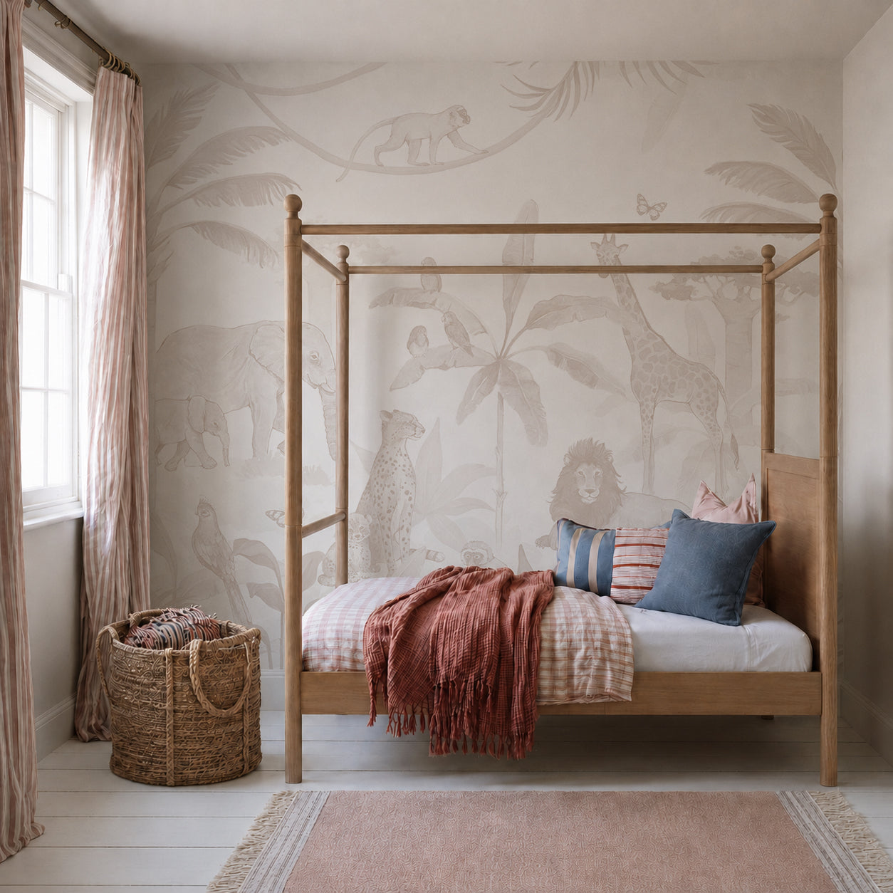 A cozy children’s room with a wooden canopy bed, pink and blue pillows, a rust-colored throw, a woven basket, and the African Safari Mural in Neutral featuring lions, giraffes, and elephants. Light streams in from a window.