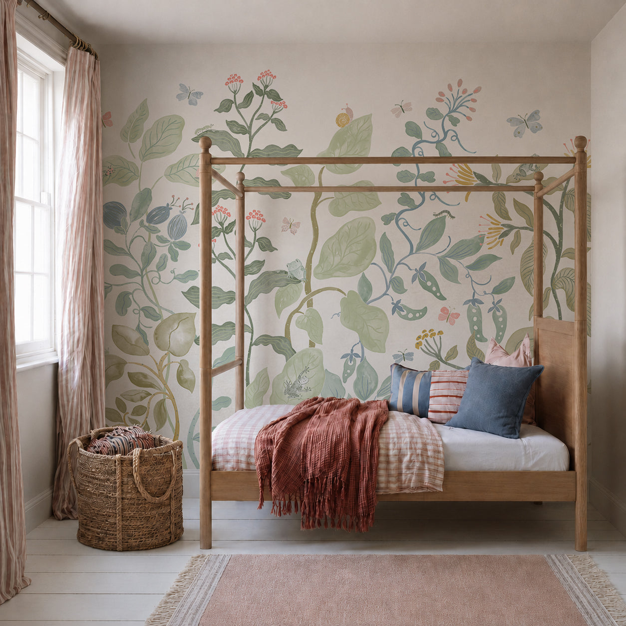 A cozy bedroom with a wooden canopy bed, pastel bedding, a woven basket, and a mural of large botanical plants and flowers on the wall creates a serene oasis. Light streams in from a window with pale pink curtains, highlighting the Secret Garden Mural that brings an enchanting floral touch to the space.