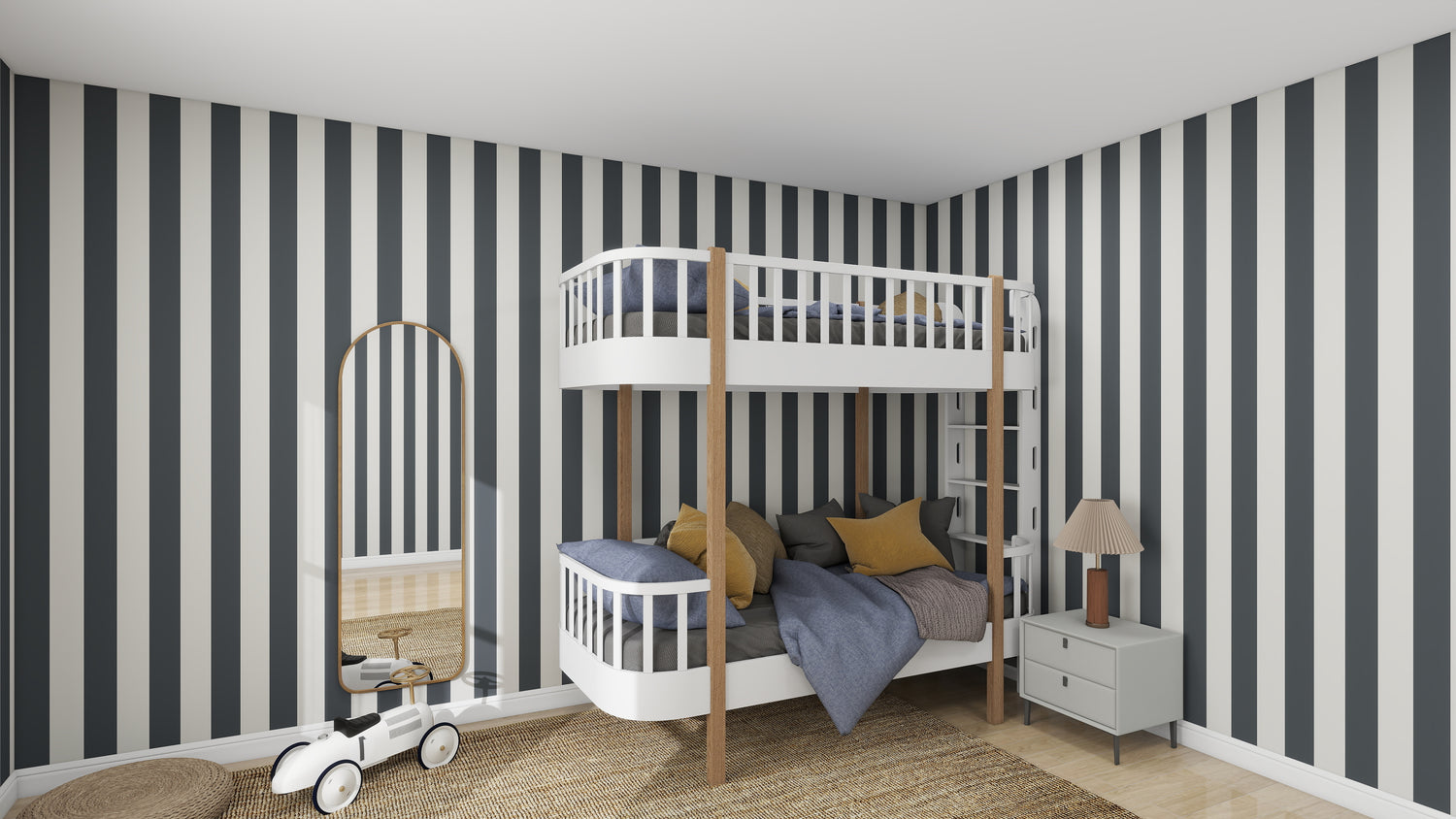 The childrens room displays a sample of munks and mes Circus Stripe Wallpaper Denim with white bunk bed featuring gray bedding, yellow accents, round mirror, lamp on nightstand, woven rug, and toy vehicle. The decor is modern, bright, and playful with black and white vertical stripes.