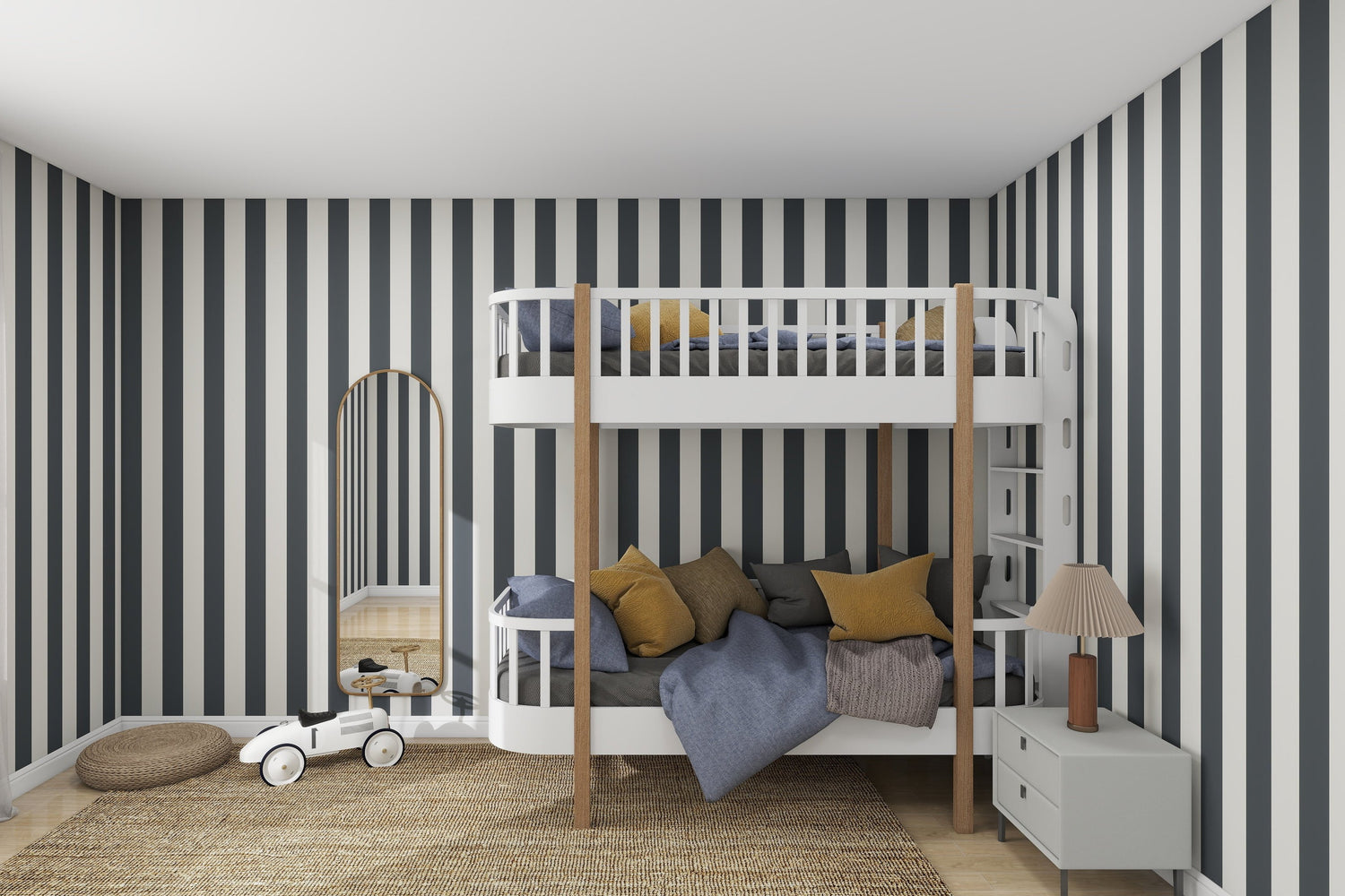 The contemporary bedroom has a lively feel with Circus Stripe Wallpaper Denim by munks and me. It includes a white bunk bed with wood accents, gray and mustard pillows, a woven rug, and charm is added by a small white dresser with a lamp and toy car.