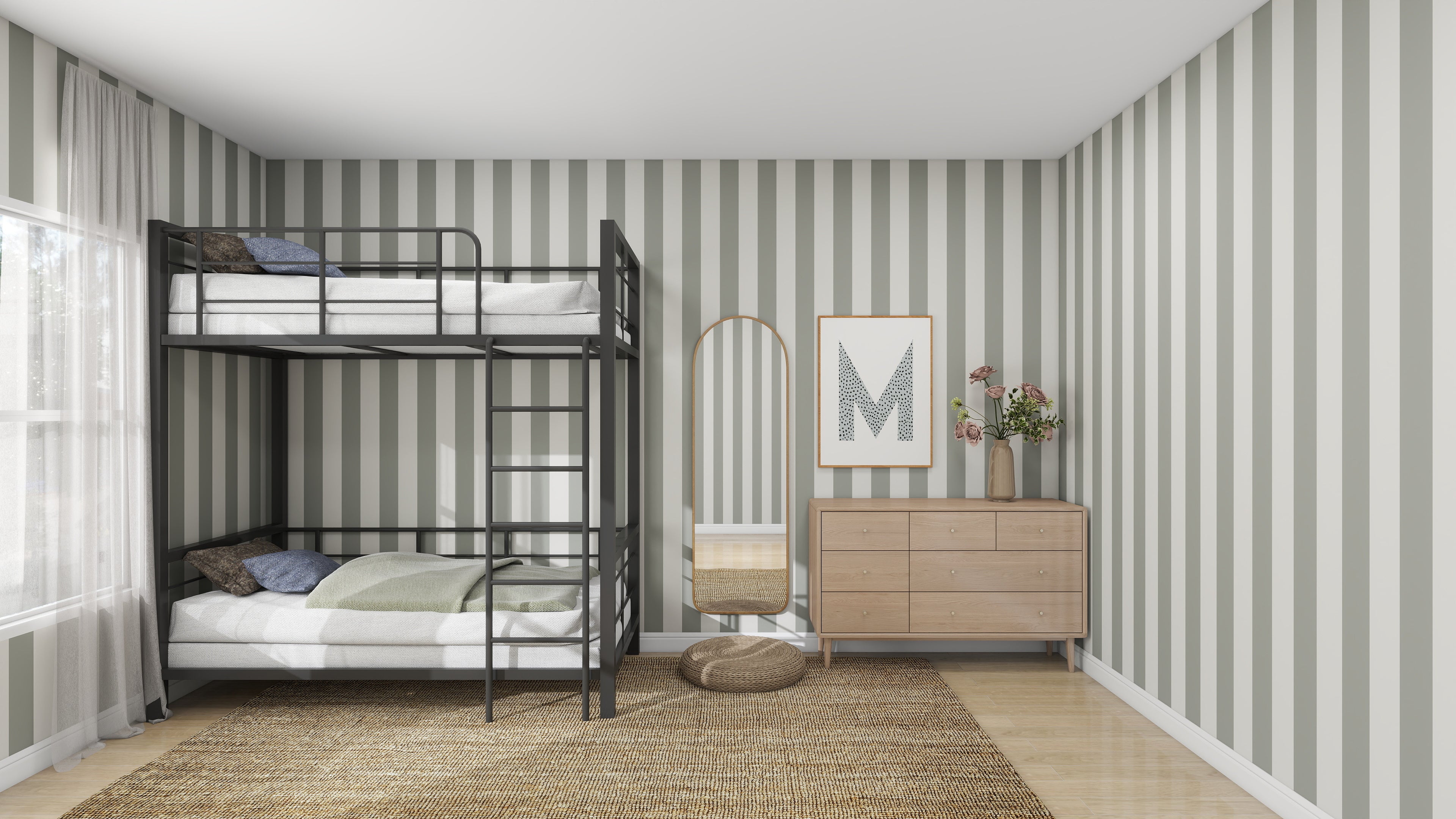 A delightful kids space features munks and mes Circus Stripe Wallpaper Matcha. It includes a black metal bunk bed with striped bedding, a wooden dresser adorned with flowers, a wicker chair, and a large mirror. Above the dresser hangs framed letter M artwork for a playful touch.