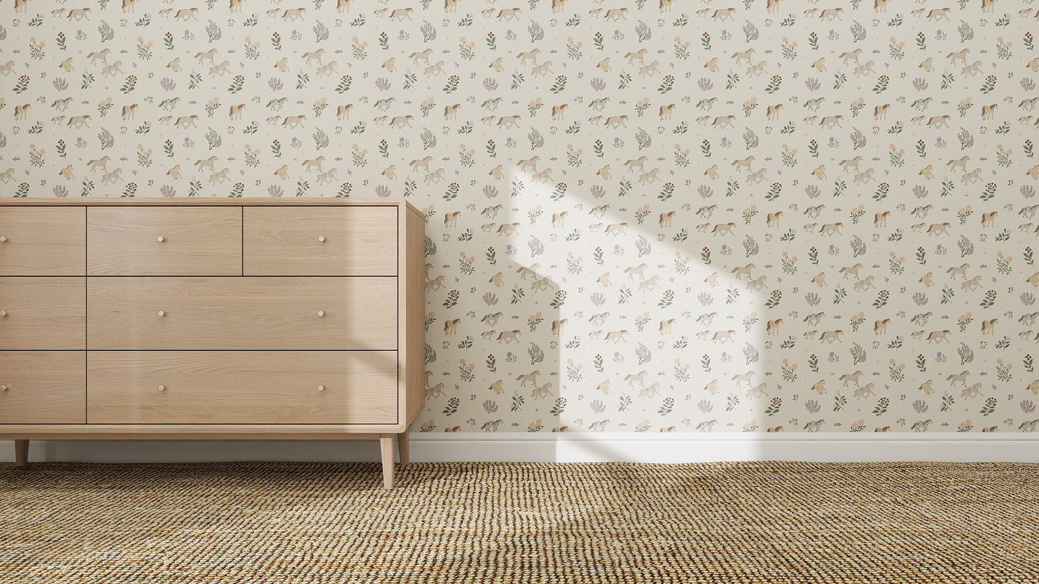 A wooden dresser with six drawers stands on a woven carpet next to a wall adorned in Quincy Horses Wallpaper Repeat Pattern, sunlight casting window shadows—a serene and artistic interior design touch.