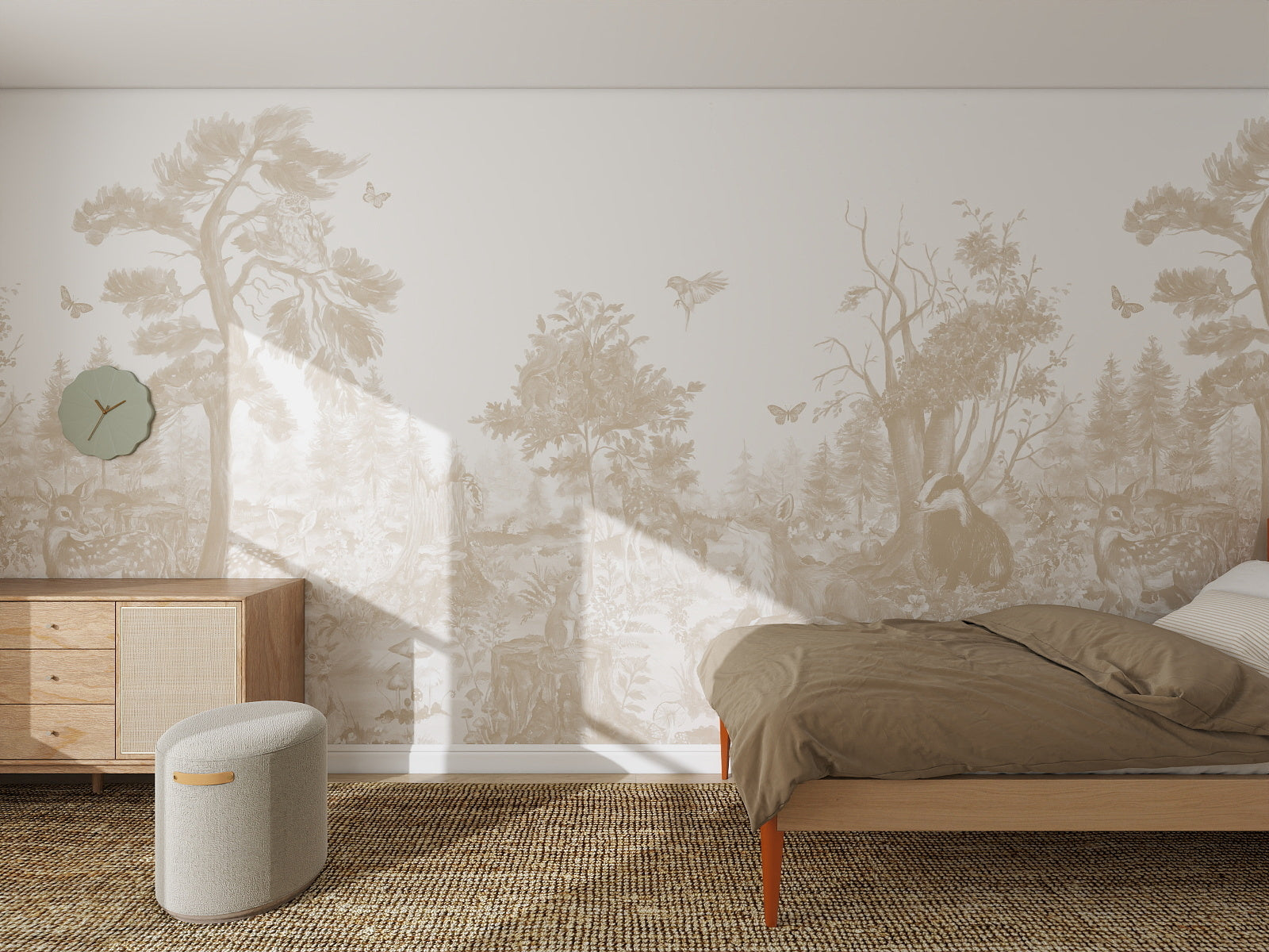 Minimalist bedroom featuring the Into The Forest Wallpaper Mural Neutral sample, light wood furniture, a bed with brown bedding, a small ottoman, woven rug, and green wall clock. Sunlight streams in through an unseen window.