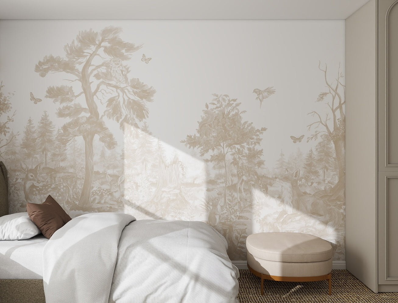 A minimalist bedroom features a bed with white bedding, brown pillows, a round beige ottoman, and the Into The Forest Wallpaper Mural Neutral. Sunlight casts serene shadows across the woodland scene in neutral tones.