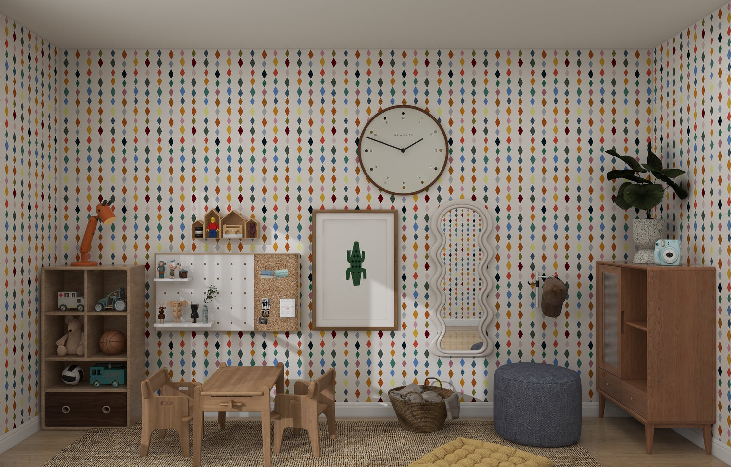 A childrens playroom features Jolly Jester Wallpaper Repeat Pattern | Multi by munks and me, a wooden table with chairs, feature walls with toy-filled shelves and a cactus picture, a large clock above, plus a pouf, small rug, and plants for a cozy finish.