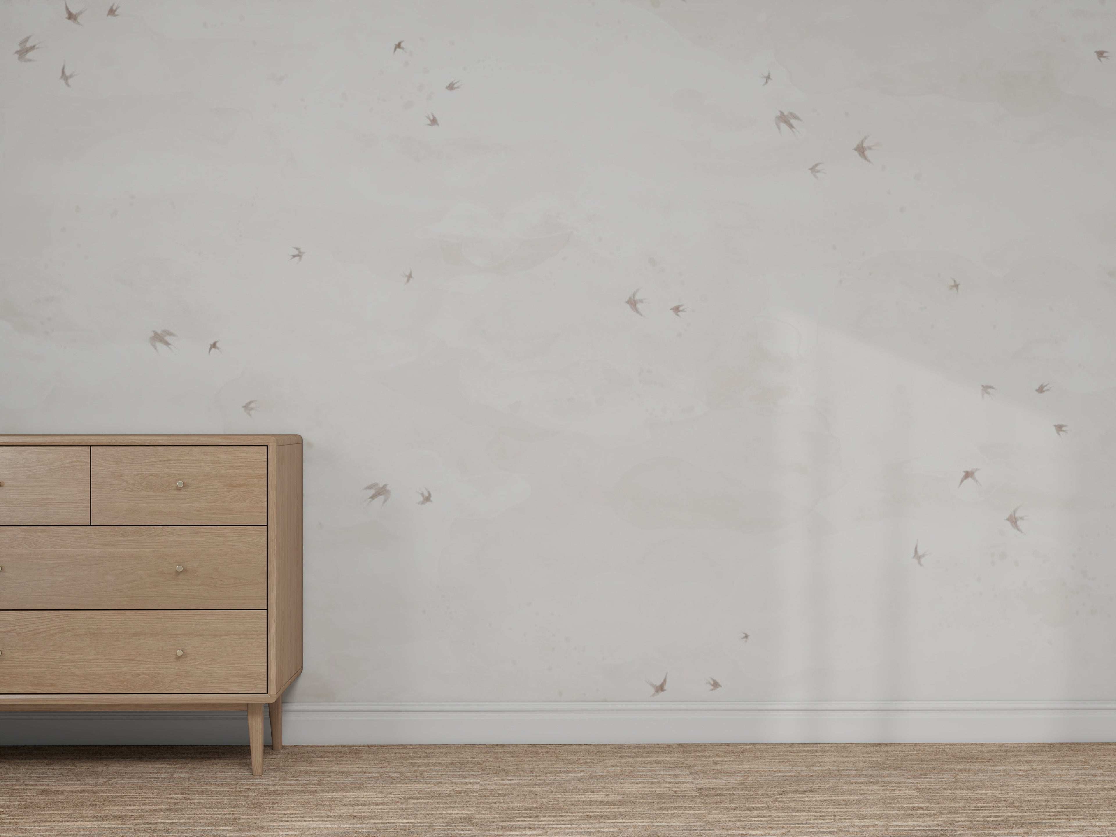 A minimalist room features a light wood dresser, beige carpet, and a white wall with small bird illustrations—an ideal space to try the Custom Greige Opals Sky Birds Mural sample and experiment with wallpaper color in soft natural light.