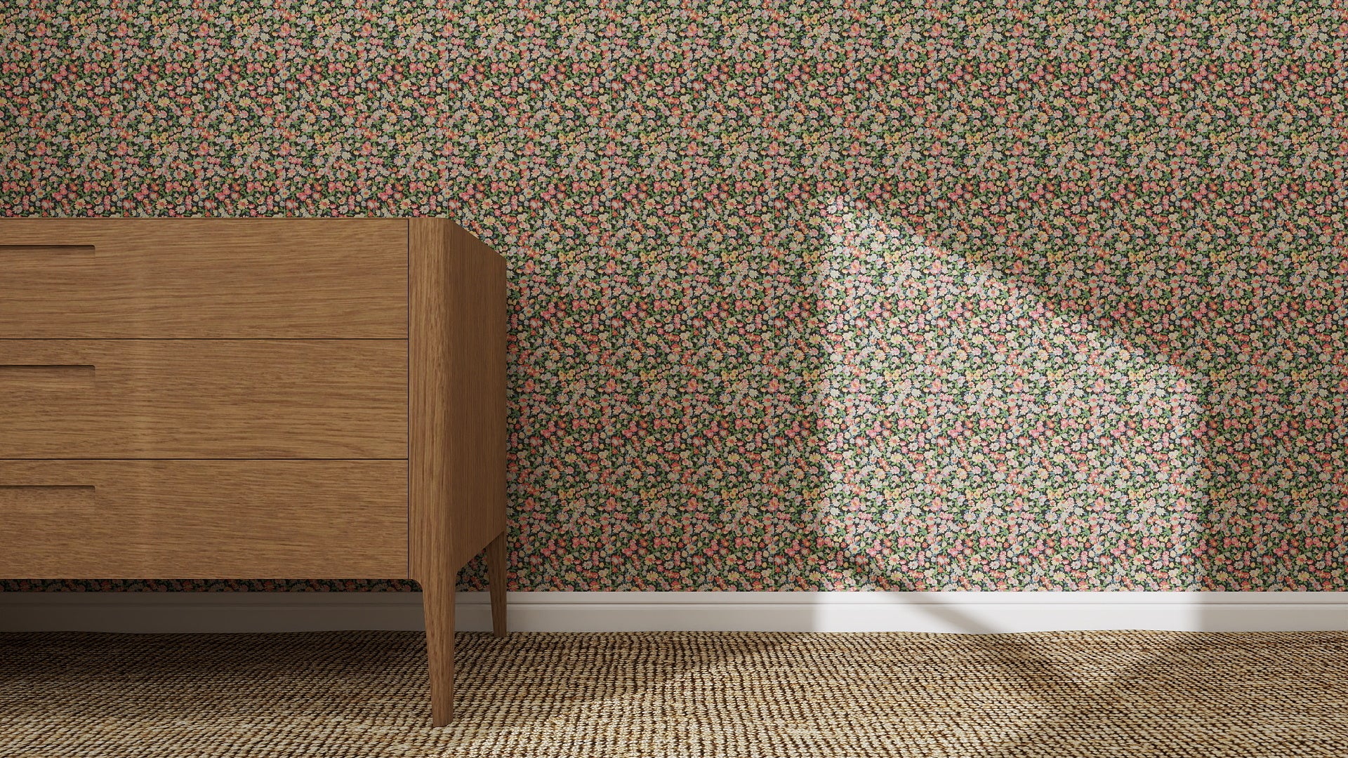 A wooden dresser on a woven carpet stands by a wall adorned with Midnight Meadow Florals Wallpaper. Sunlight brightens the dense floral patterns, showcasing the wallpaper’s quality as a bright patch of light falls across the design.