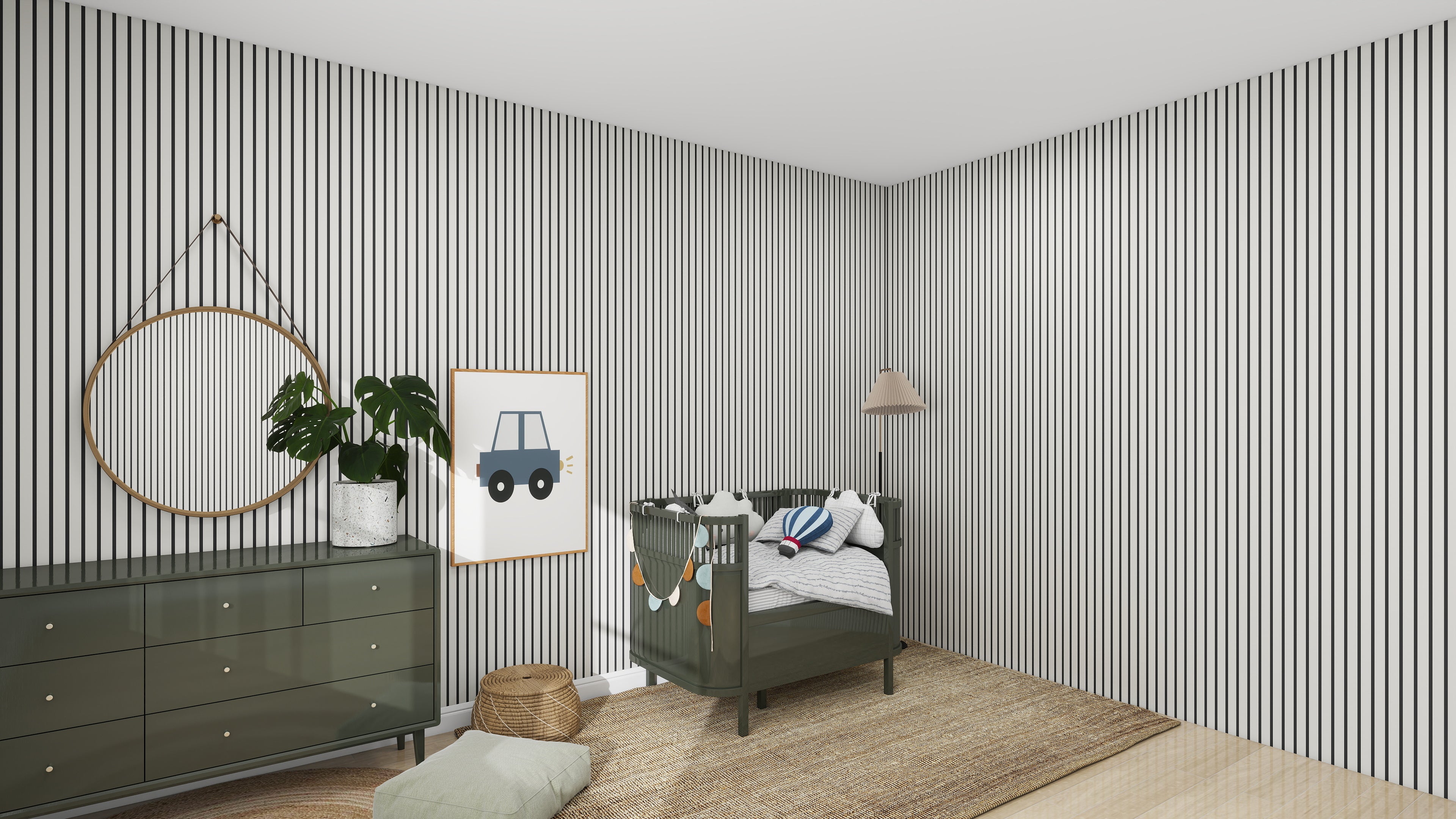 A nursery room features munks and mes Pinstripe Wallpaper Charcoal, a green crib with stuffed toys, and a framed car picture. A green dresser holds a plant beneath a round mirror. A floor lamp complements the woven rug to complete the decor.