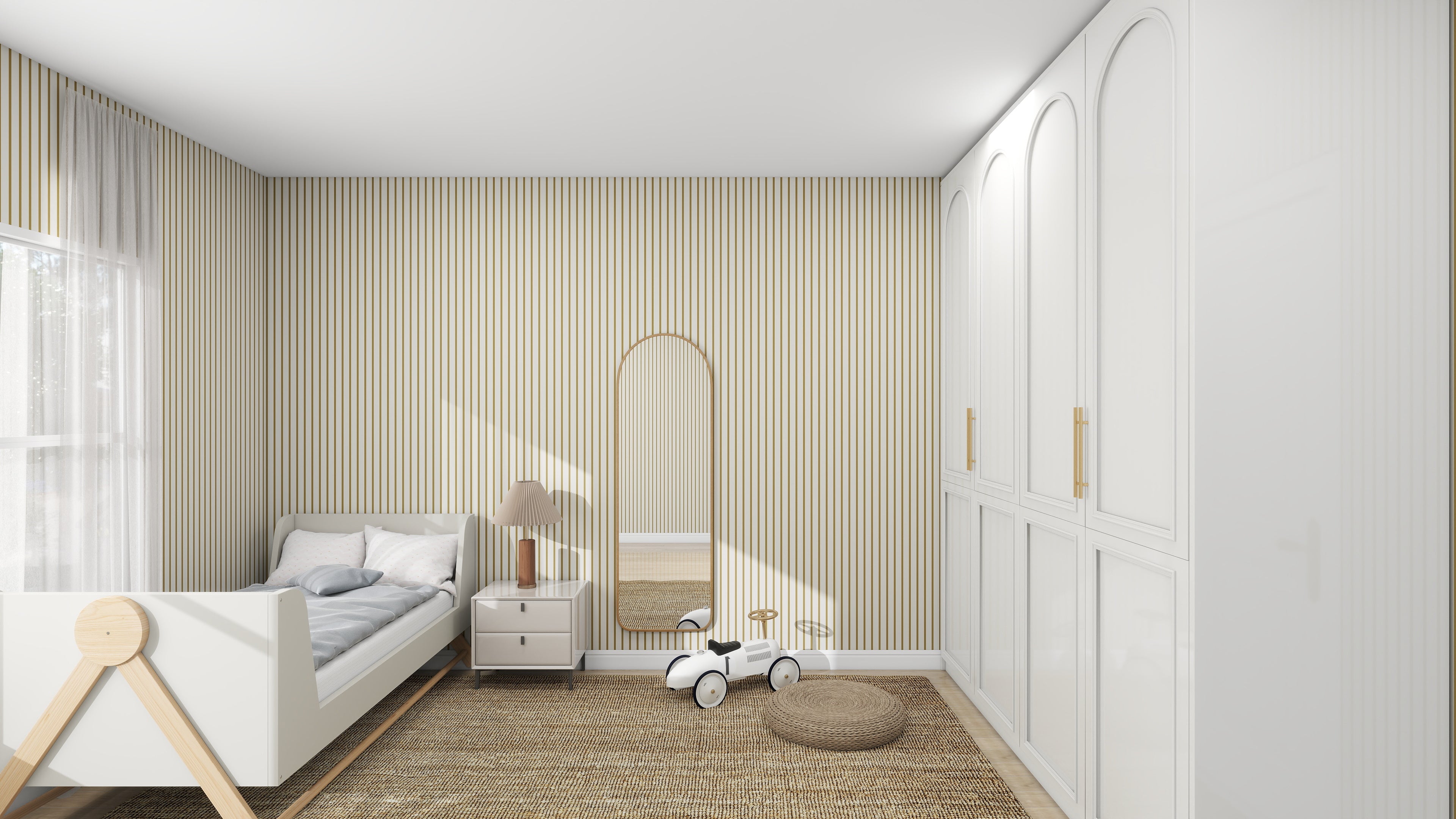 A modern nursery with wooden floors and Pinstripe Wallpaper Moss by munks and me. A small bed with white bedding sits beside a lamp on a nightstand. A blush rose toy car, rounded mirror, and woven cushion adorn the floor, while white cabinets line the wall.