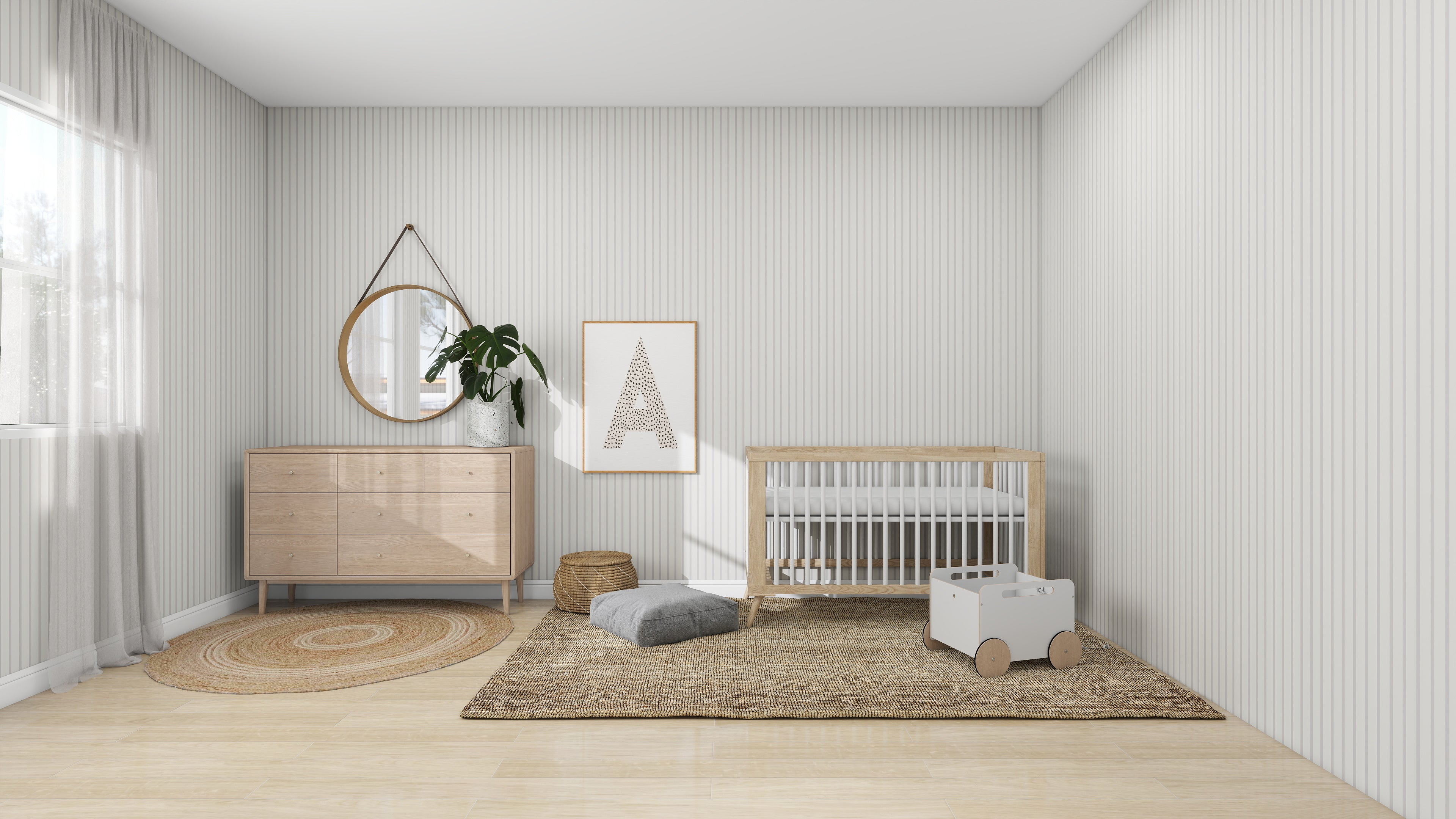 In a minimalist nursery with light walls and wood floors, munks and mes Pinstripe Wallpaper in Soft Beige stands out. The space includes a crib, dresser with round mirror, geometric wall art, blush rose rug, toy box on wheels, and warm light filtering through the window.
