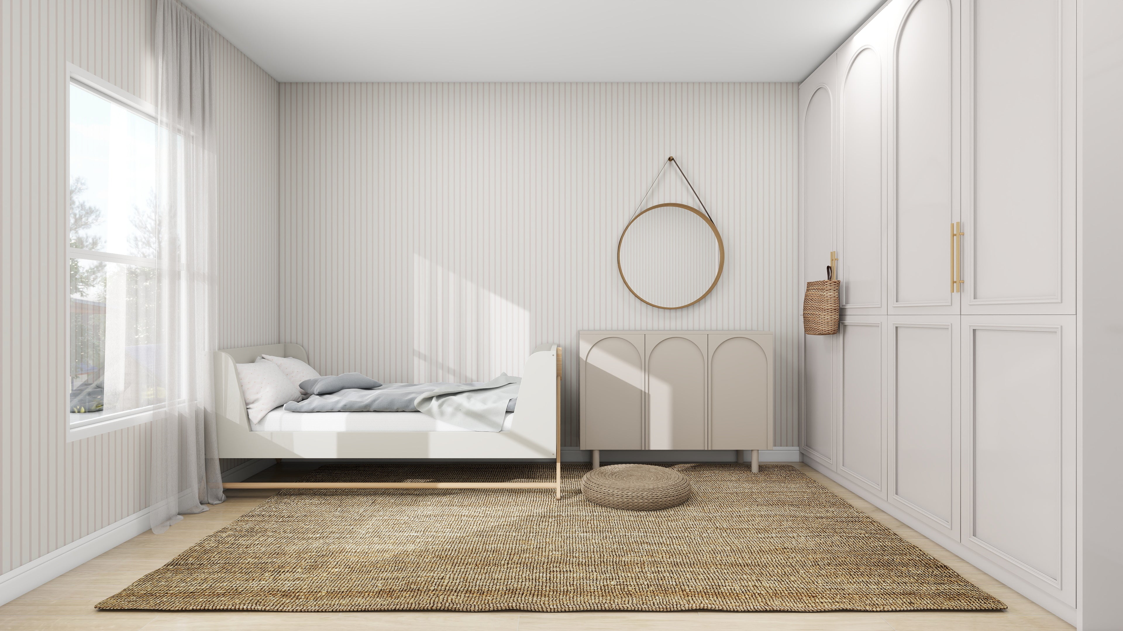 A minimalist bedroom features a single bed with light gray bedding and a woven rug. A round mirror is above a cabinet next to a wicker basket. Large white wardrobes have Pinstripe Wallpaper Blush Rose by munks and me accents, and natural light pours through sheer-curtained windows.