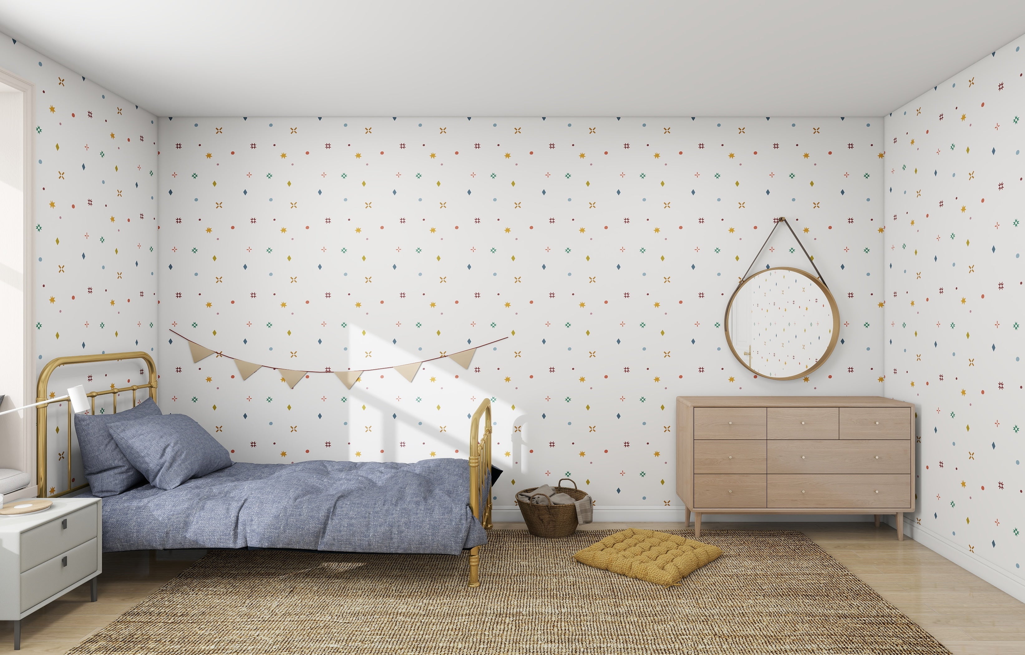 A minimalist bedroom features Scandinavian interiors with a single bed and blue duvet. The Pebble and Patch Wallpaper by munks and me, adorned with colorful patterns, complements the wooden dresser and round mirror. A pendant banner, woven rug, and basket decor complete this modern design.