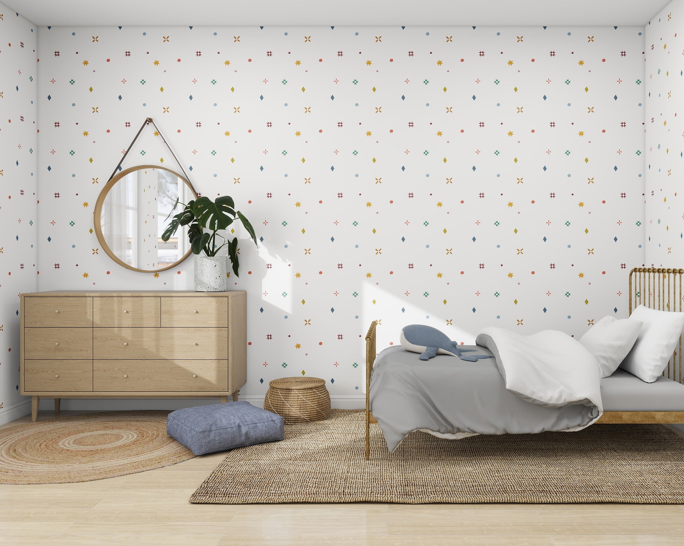 A Scandinavian-inspired bedroom features a light wooden bed with gray bedding, a circular mirror above a sleek dresser with a plant, and a wicker basket on a woven rug. Subtle geometric patterns from the munks and me Pebble and Patch Wallpaper enhance the modern design.
