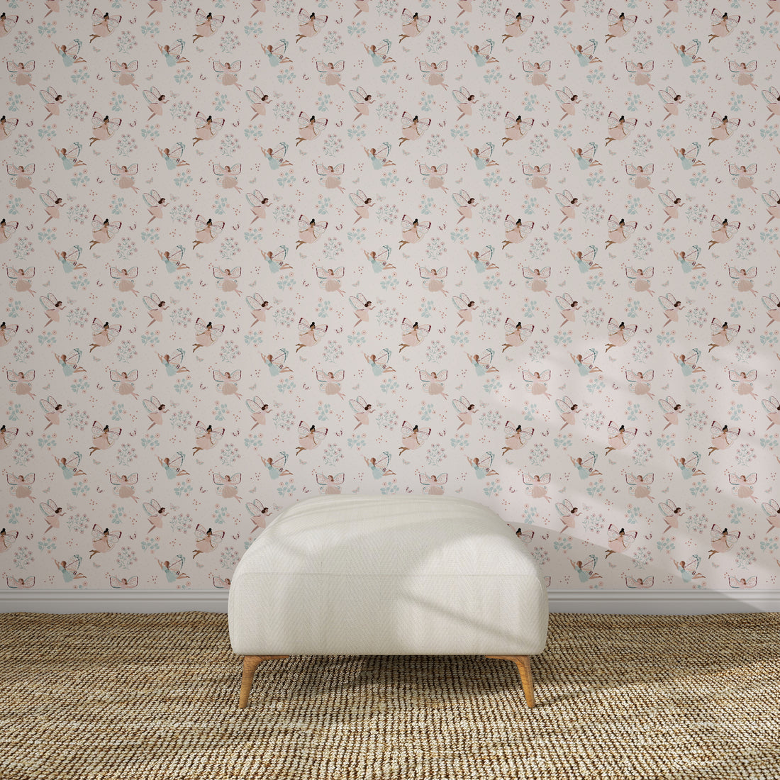 A white upholstered bench on a brown woven rug sits against a light pink wall decorated with Fairy Wonderland Pinks Wallpaper Repeat Pattern, featuring illustrated cats and flowers in a kids&