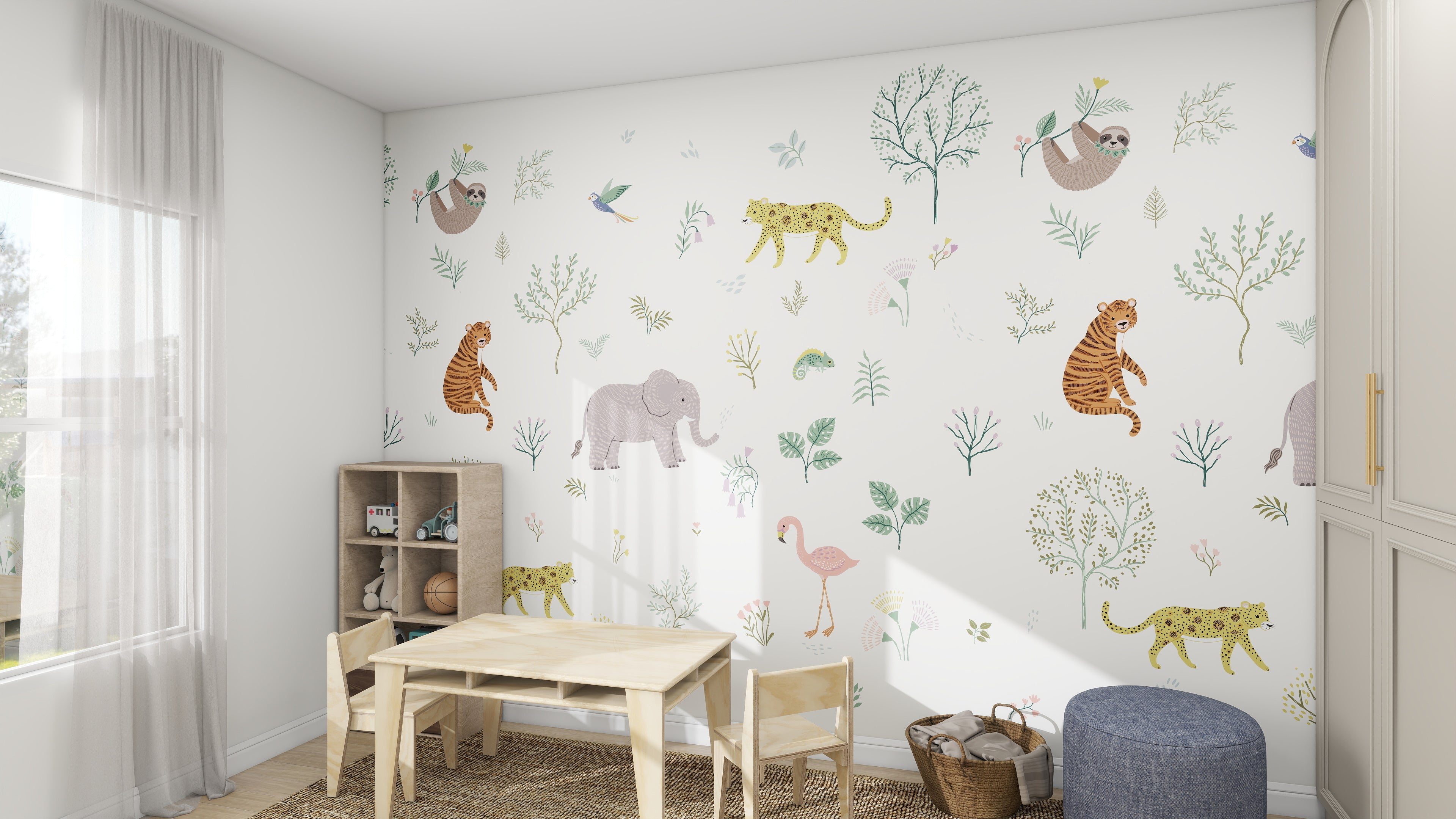 A vibrant childrens playroom features the Wild Wonders Wallpaper Mural from munks and me, adorned with colorful animal illustrations like tigers and sloths. A small wooden table with chairs on a jute rug and a plush ottoman complete the space.