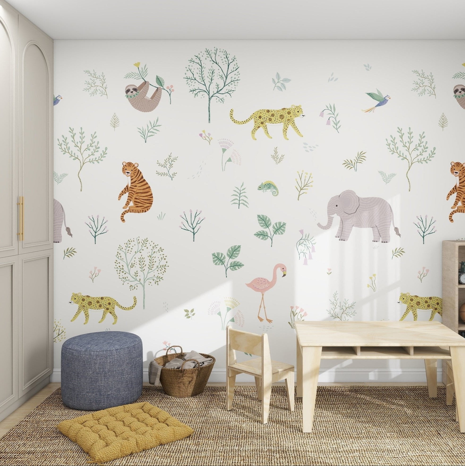 Children’s playroom with a table, chairs, pouf, and shelves, featuring the Wild Wonders Mural with playful illustrations of elephants, tigers, sloths, leopards, flamingos, and trees on a white background.