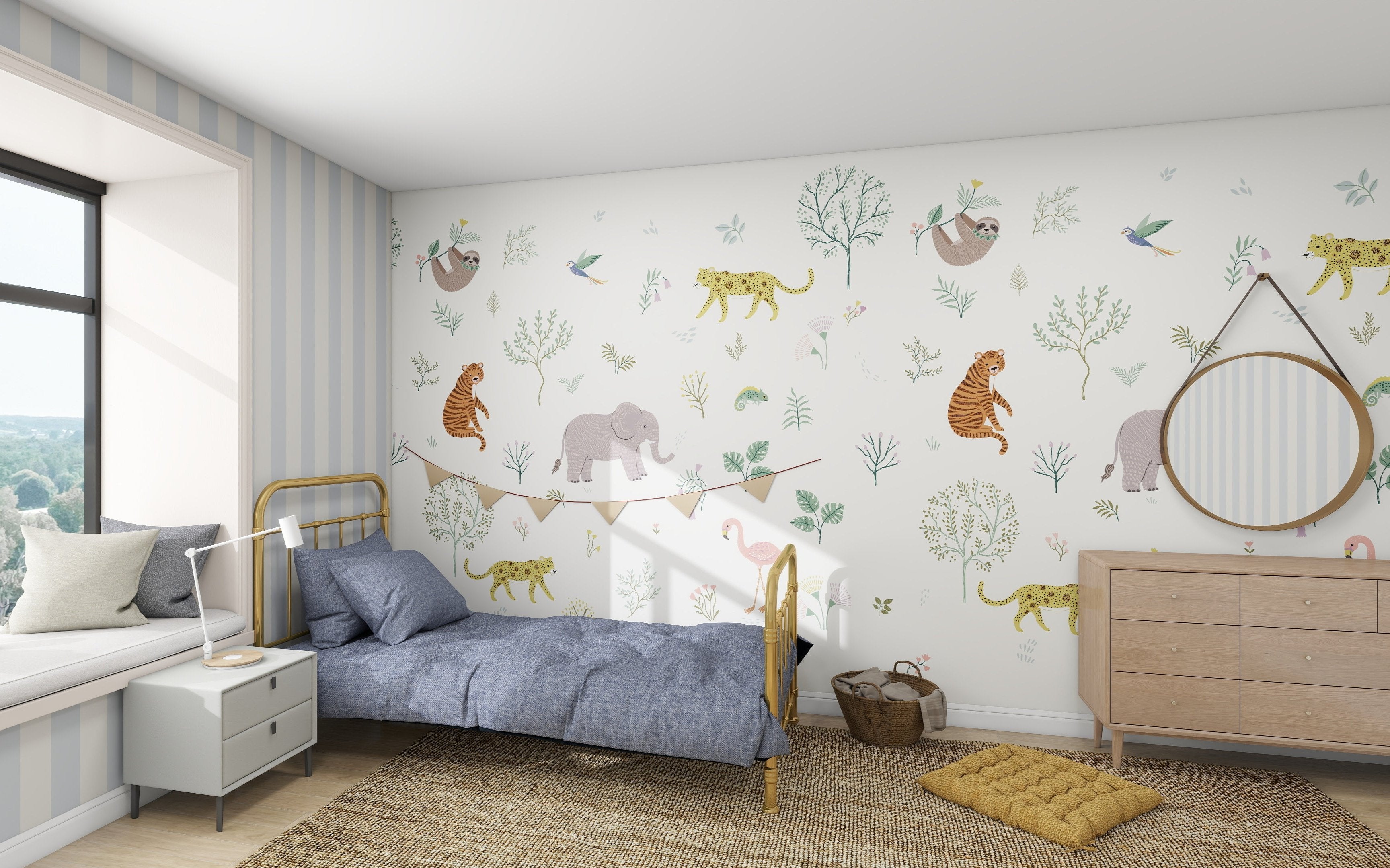The childrens room features a jungle theme with the munks and me Wild Wonders Wallpaper Mural, showcasing tigers, elephants, sloths, and birds. It includes a cozy single bed with a blue blanket, a rug, window seat, dresser with round mirror, and light blue striped walls.