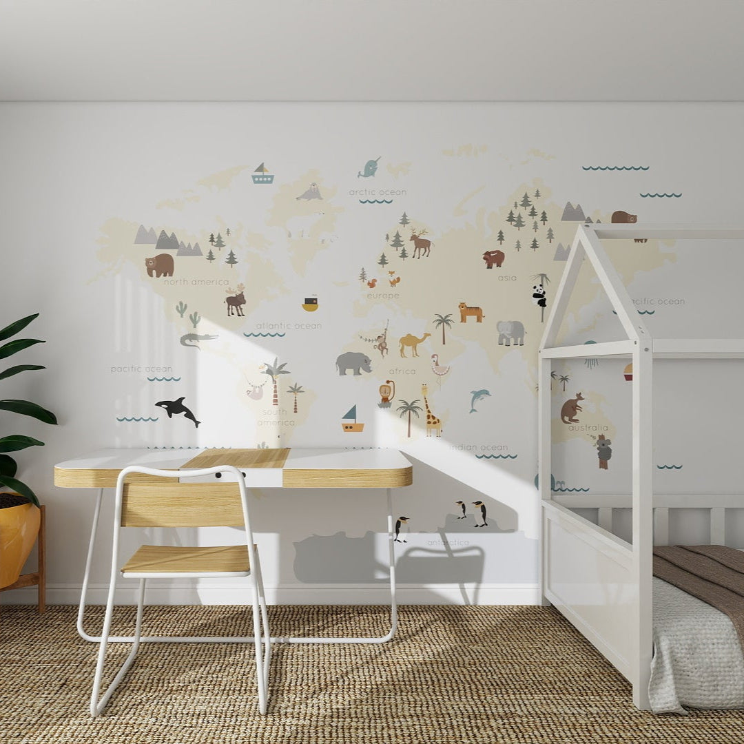 A kid’s room featuring the Character World Map Wallpaper Mural with illustrated animals and landmarks, plus a modern desk, chair, white house-shaped bed frame, and woven rug—perfect for inspiring curiosity in kids’ decor.