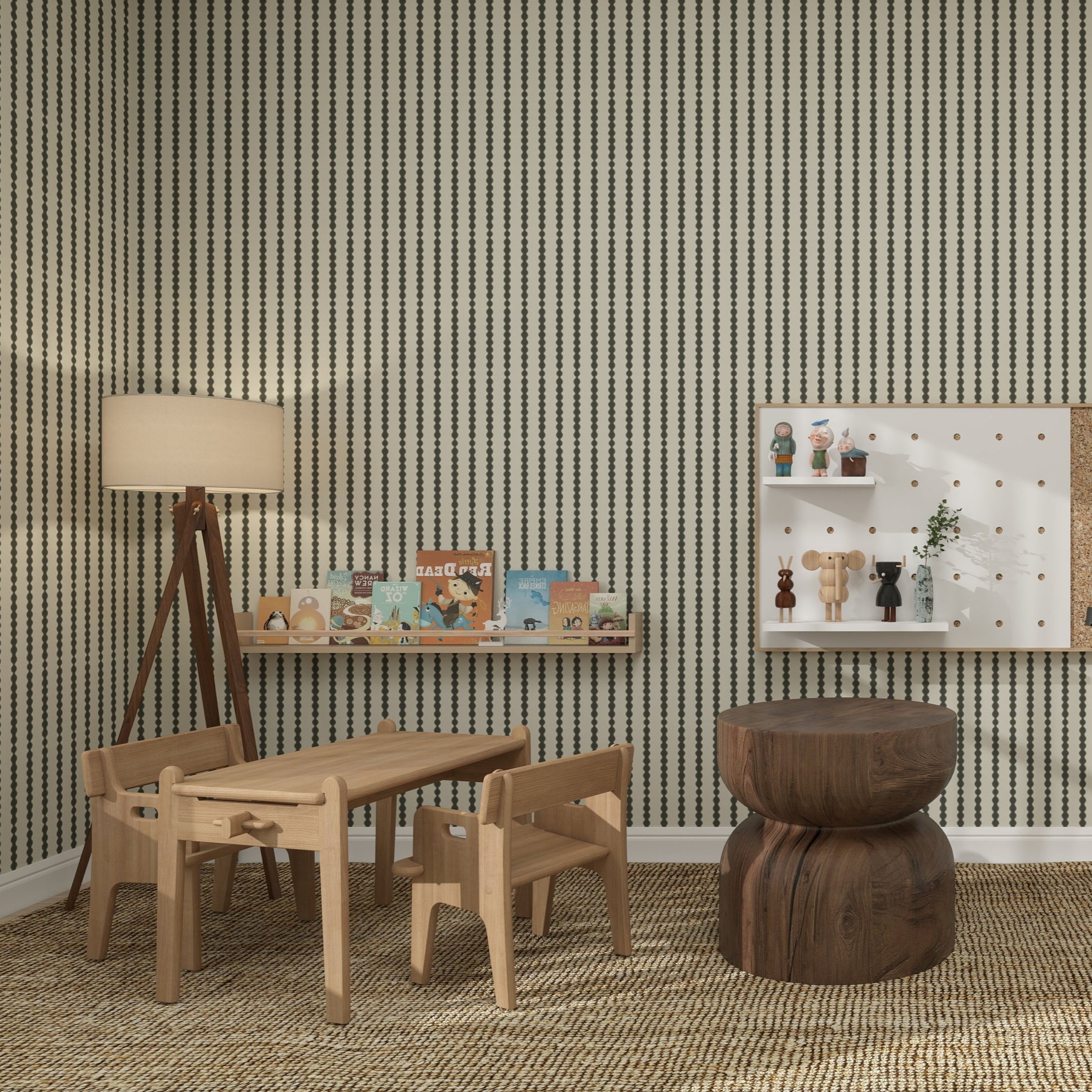 A cozy children’s playroom with light wooden furniture, small table and chairs, tripod lamp, books on a wall shelf, and a calming atmosphere enhanced by nursery decor and Little Abacus Stripe Forest bold vertical stripe walls.