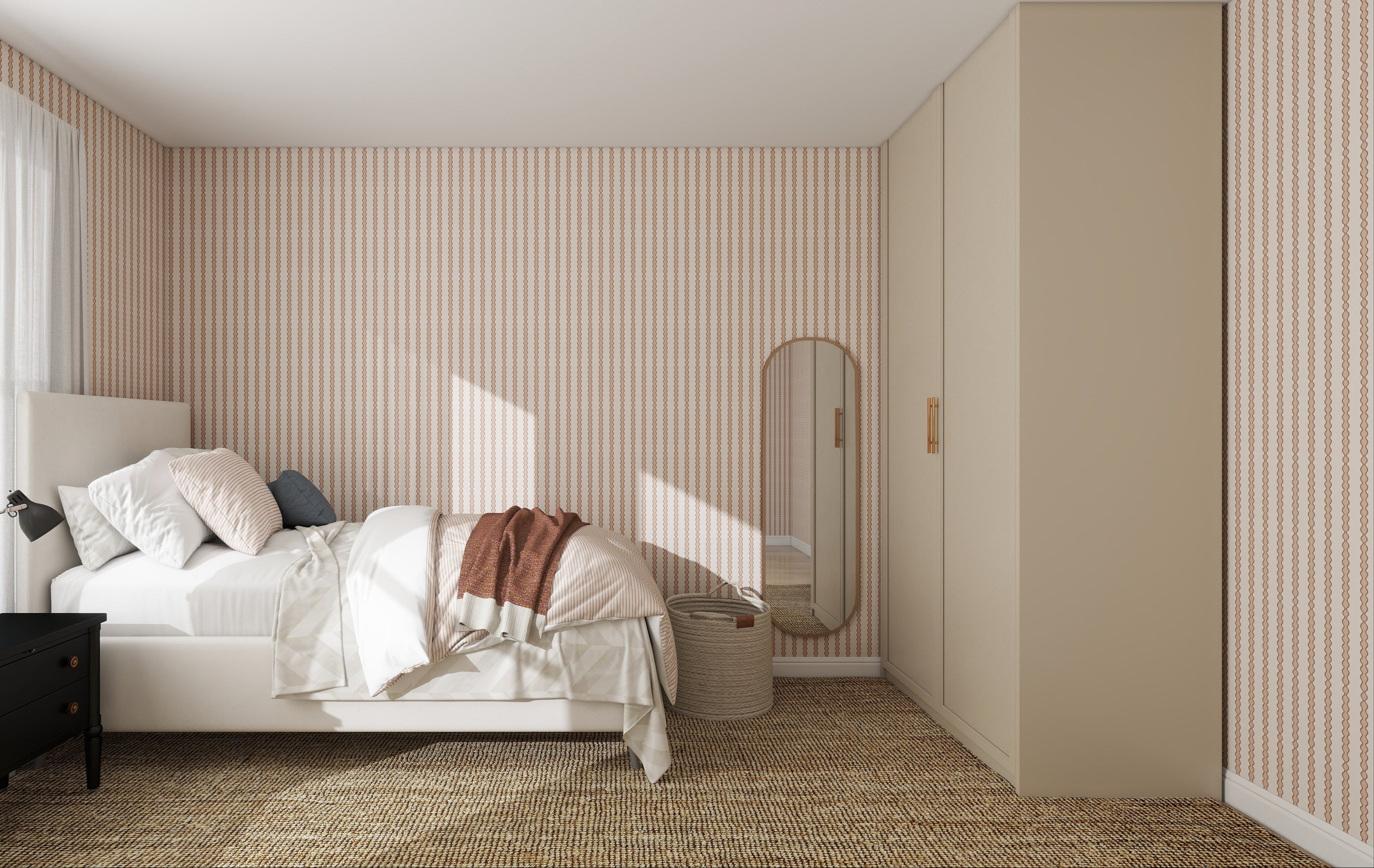 A cozy bedroom features a bed with white bedding, a black nightstand and lamp, floor mirror, beige wardrobe, and sunlight streaming onto the Little Abacus Stripe Rose Wallpaper Sample, highlighting its quality and color.