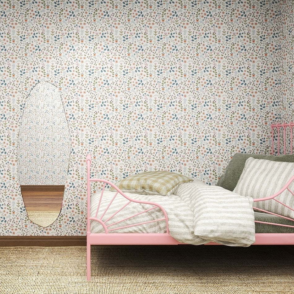 A bedroom featuring a pink metal bed, striped bedding, green and beige pillows, a textured rug, an oval mirror, whimsical decor, and Ditsy Blooms Wallpaper Repeat Pattern in lively blue, green, and orange tones.