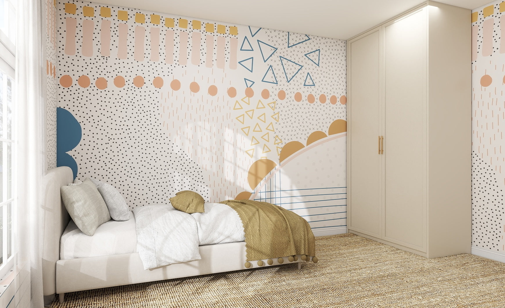 A modern bedroom with a bed, neutral bedding, and a textured rug. The wall displays the Evie Abstract Wallpaper Mural in blue, peach, and gold geometric patterns. A large white wardrobe sits in the corner with natural light streaming through the window.