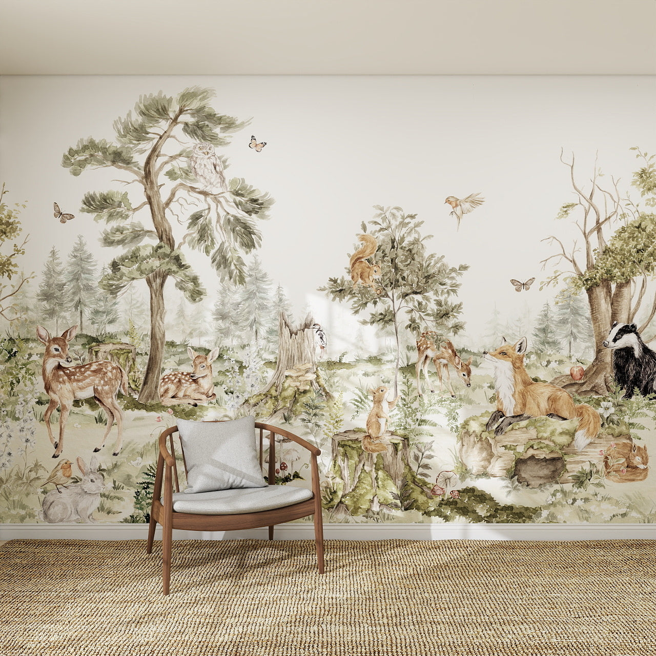 The Into The Forest Wallpaper Mural features illustrated foxes, deer, badgers, squirrels, rabbits, and birds among lush trees and greenery. A wooden chair with a cushion sits in front on a woven rug.