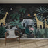 A neutral chair and cushion sit before the Charcoal Jungle Wallpaper | Sample, which features lush tropical plants, illustrated giraffes, an elephant, flamingos, and parrots—all showcased beautifully in a modern room with a woven rug.