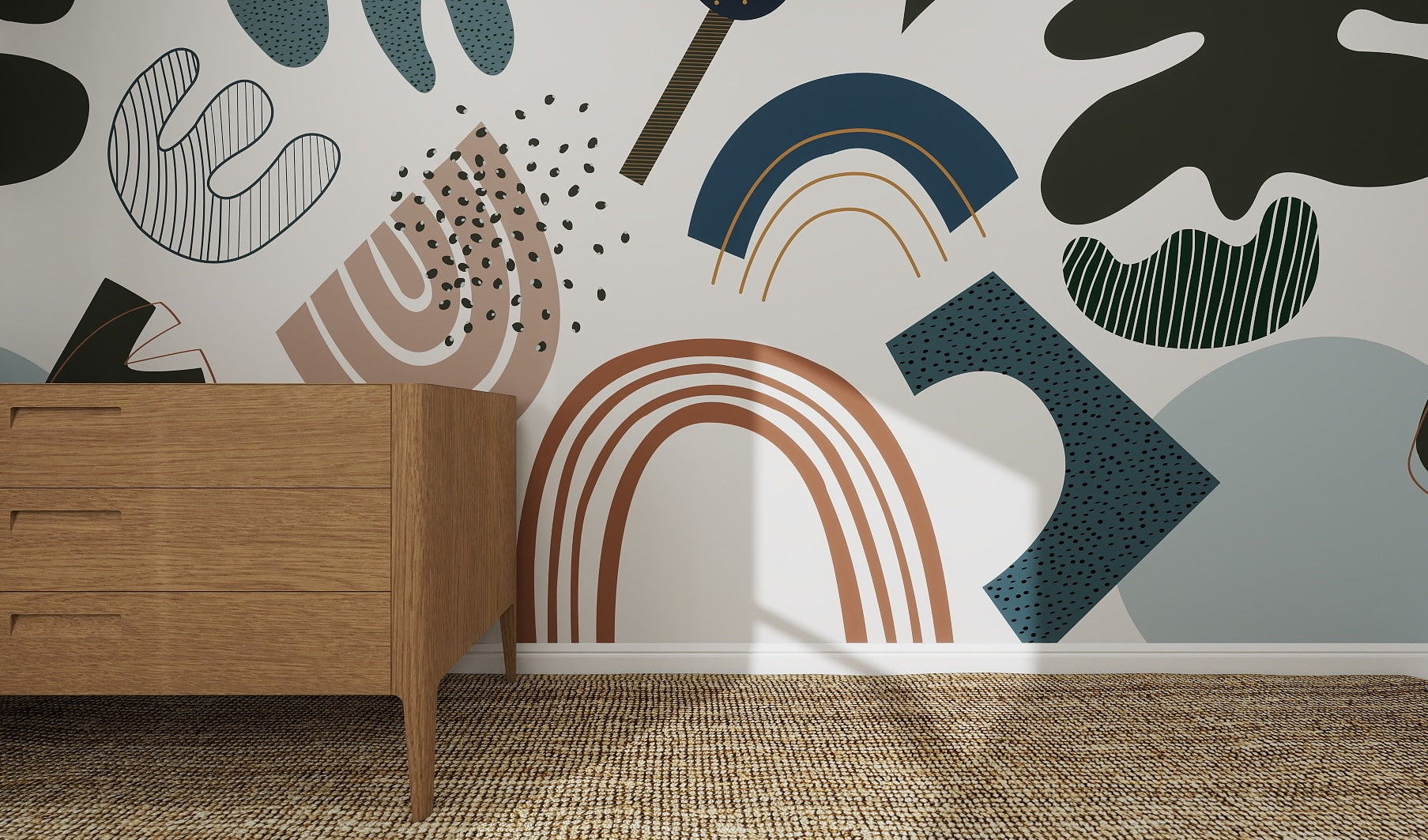 A wooden dresser stands on a woven rug by a white wall decorated with the Little Erin Abstract Wallpaper Mural | Blue, featuring bold muted shapes in blue, brown, green, and black for a modern artistic feel.