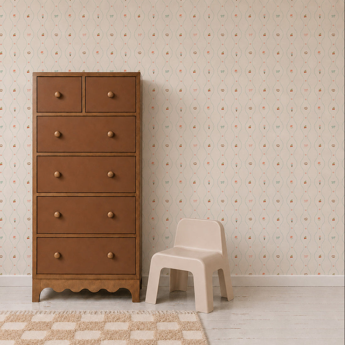 A brown dresser with six drawers stands next to a small beige step stool, against a wall adorned with Little Patisserie Stripe Wallpaper and a light-colored rug on the floor.