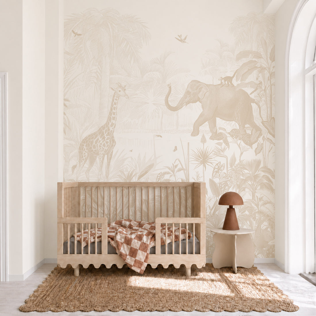 The Magic Jungle Mural features a line-art jungle scene with a giraffe, an elephant, and tropical foliage behind a wooden crib.
