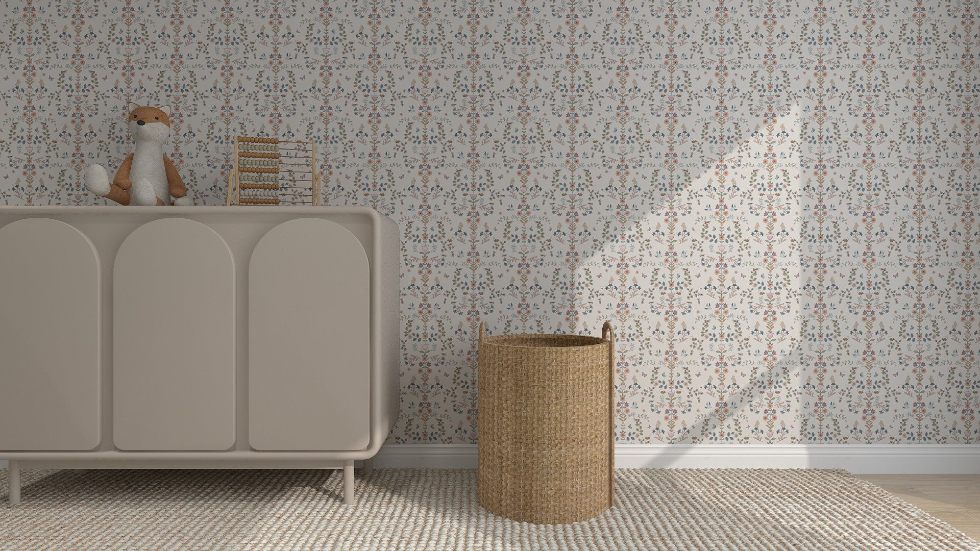 A nursery with Forest Tales Wallpaper Repeat Pattern, a light beige dresser holding a plush fox and an abacus, and a woven wicker basket on a textured rug. Sunlight casts soft shadows on the wall.