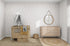 A cozy nursery features a wooden crib with a white canopy and munks and mes Bibi Butterflies Wallpaper. A natural wicker basket and circular rug decorate the floor, a round mirror hangs above the wooden dresser, all set against walls with subtle hand-drawn details.