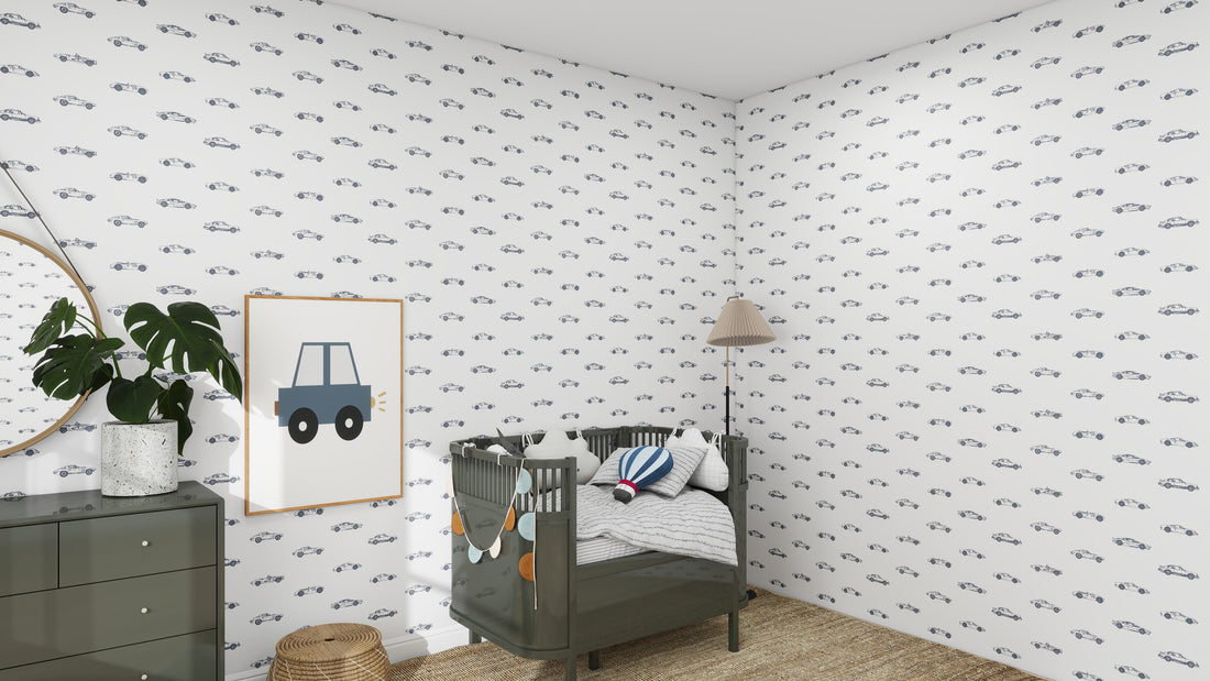 The nursery decor boasts white walls adorned with munks and mes Vintage Cars Wallpaper Repeat Pattern. A green crib, dresser with a plant, woven rug, and standing lamp complete the room. A framed blue car illustration adds charm, while toys rest invitingly in the crib.
