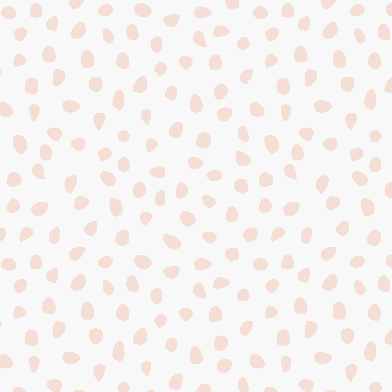 Sprinkle Wallpaper Sample, Pink features light pink, irregular polka dots scattered across a white background in a seamless, minimalist design. The varying sizes and shapes of the dots lend subtle charm and softness to any space, making this high-quality wallpaper an ideal choice for those seeking a playful yet understated look.