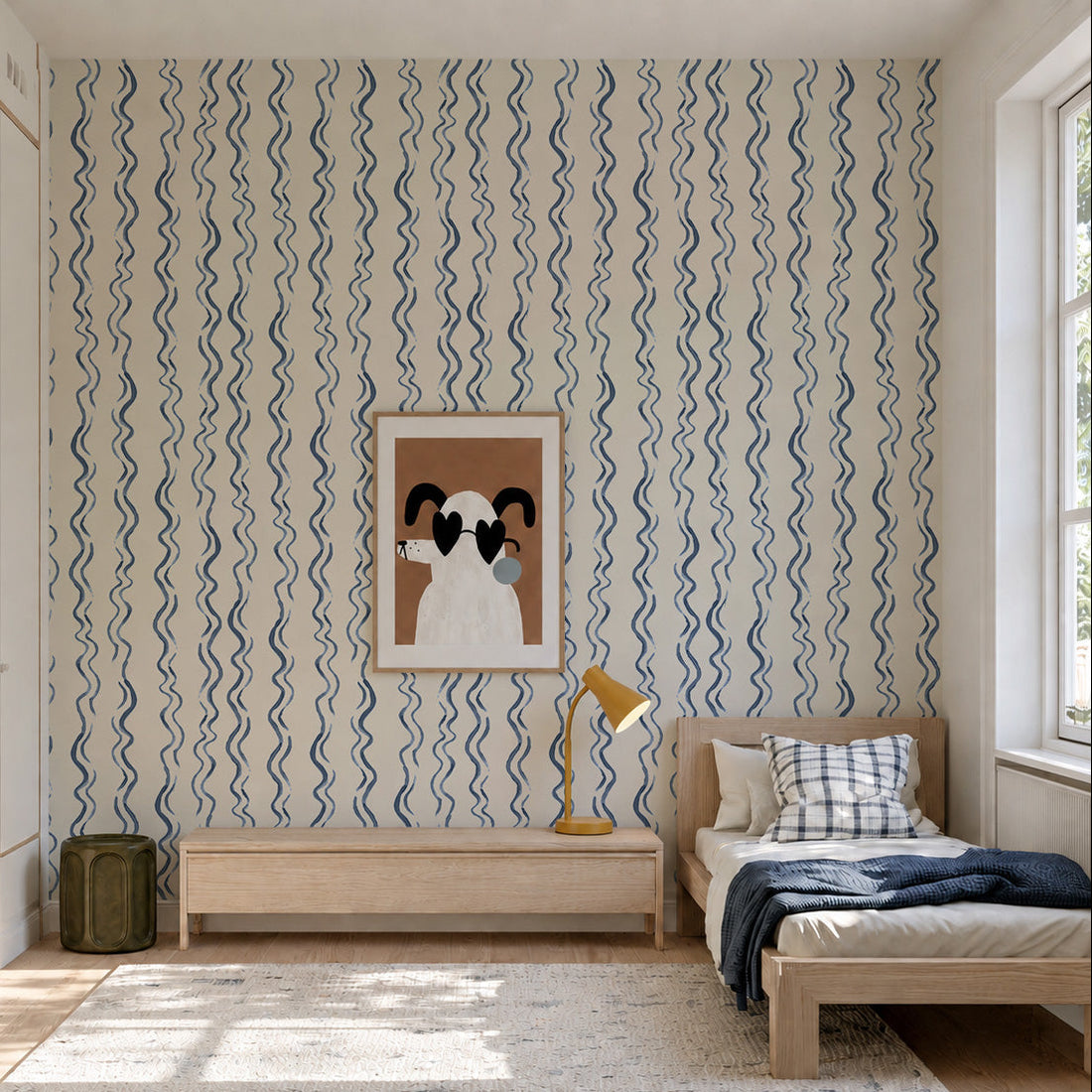 A minimalist bedroom featuring a single bed with checkered bedding, a wooden nightstand, a yellow lamp, playful Wiggle Stripe Wallpaper in Blue, a framed abstract dog art piece, and large windows that fill the space with natural light.