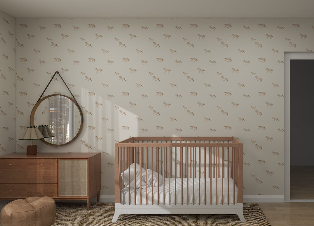 The minimalist nursery boasts munks and mes Winter Wild Horses Wallpaper Repeat Pattern, creating a stylish backdrop. A wooden crib with white bedding pairs perfectly with the brown dresser and round mirror, where a small lamp casts a warm glow over the woven rug.