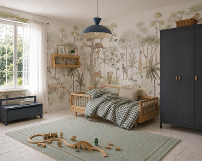 A cozy kids bedroom featuring the Safari Savannah Adventure Mural hand painted on the walls, a wooden bed with checkered bedding, a blue wardrobe, a toy train set on a green rug, and natural light streaming through a window with white curtains.