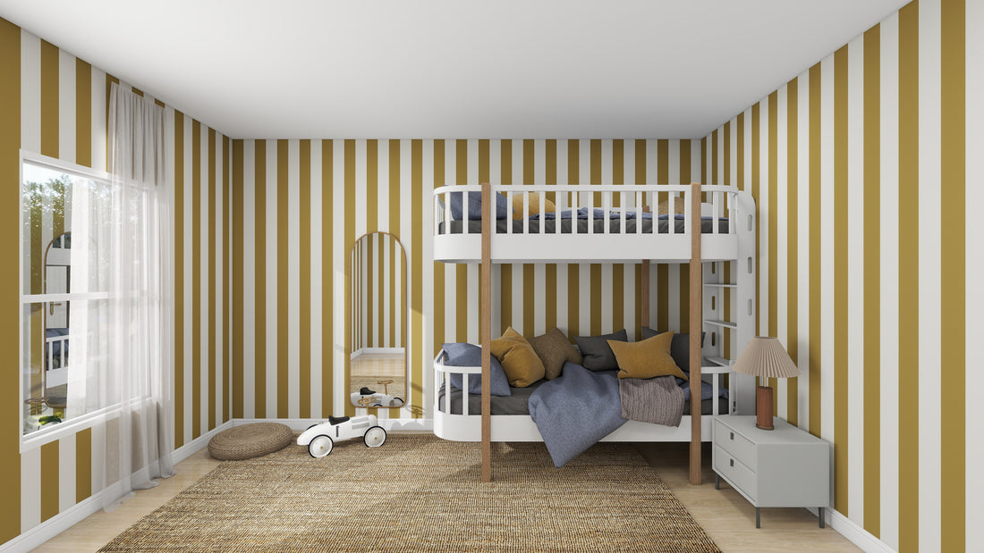 Childrens bedroom with Circus Stripe Wallpaper Moss by munks and me. This cozy kids space has a bunk bed with gray bedding, cushions, a round rug featuring a small white toy car, a mirror, and a nightstand with a lamp near the large window.