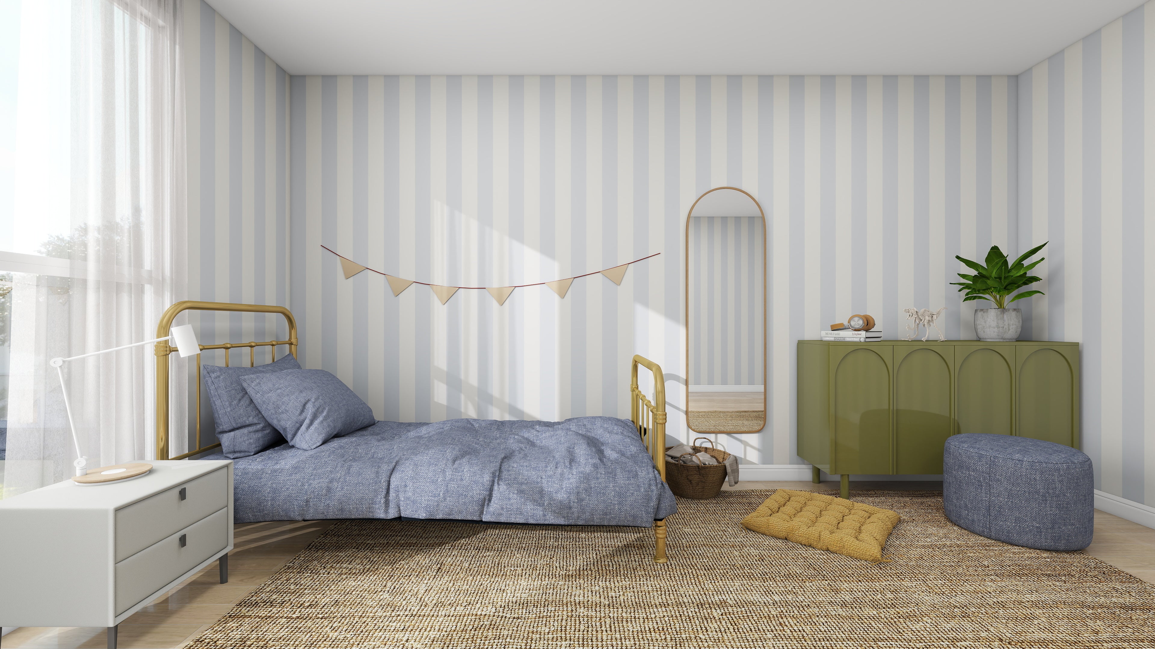 A cozy bedroom with munks and mes Circus Stripe Wallpaper Sky showcases a bed in blue bedding, a gold frame, and a green cabinet with plants. A wicker basket, round mirror, pouf, floor cushion, and pennant bunting add charm as natural light highlights the vibrant color palette.