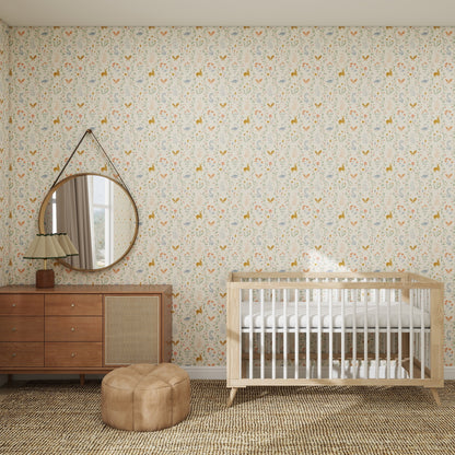 A cozy nursery with Coles Berry Patch Wallpaper Repeat Pattern, a wooden crib, brown dresser with lamp and round mirror, tan pouf, woven rug, and sunlight streaming through a window with beige curtains.