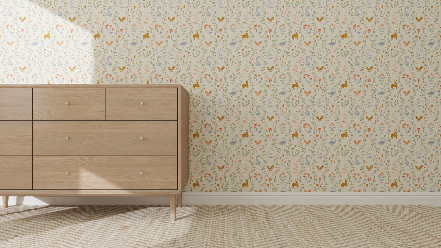 A dresser stands against a wall decorated with Coles Berry Patch Wallpaper Repeat Pattern, featuring colorful florals. The floor below is covered with a light, textured carpet.