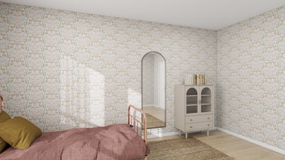 A bedroom with a pink bed, olive pillows, and munks and mes Creatures Great and Small Wallpaper creates an adorable nursery vibe. An arched mirror leans against the wall, with a small cabinet of books to the right. Natural light streams in, enhancing the cozy atmosphere.