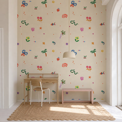 A bright room with a wooden desk and chair, pink bench, woven rug, and playful Doodle Dreams Mural featuring colorful flowers, animals, and whimsical doodles. Large arched windows let in natural light.