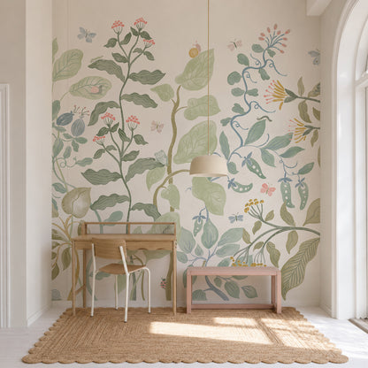 A light-filled room with a wooden desk and chair, a pink bench, and a woven rug. The wall features the Secret Garden Mural—a colorful botanical design with large leaves, flowers, and small insects.