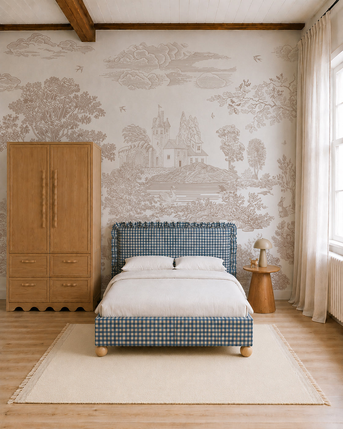 Cozy bedroom with a blue gingham bed, wooden wardrobe, round side table with lamp, light rug, and scenic Forest Hideaway Mural, Neutral featuring a castle and trees. Sunlight filters through sheer curtains.