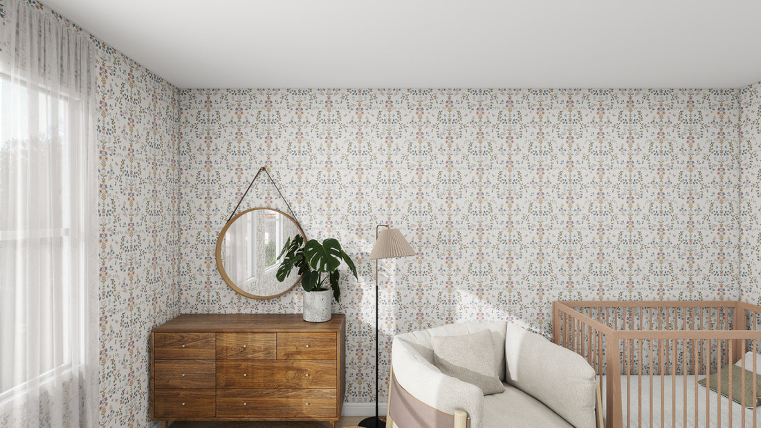 A cozy nursery decorated with munks and mes Forest Tales Wallpaper Repeat Pattern adds color. It features a wooden crib, dresser with a round mirror above, and a potted plant. A beige armchair, floor lamp, and natural light from the window complete the inviting space.