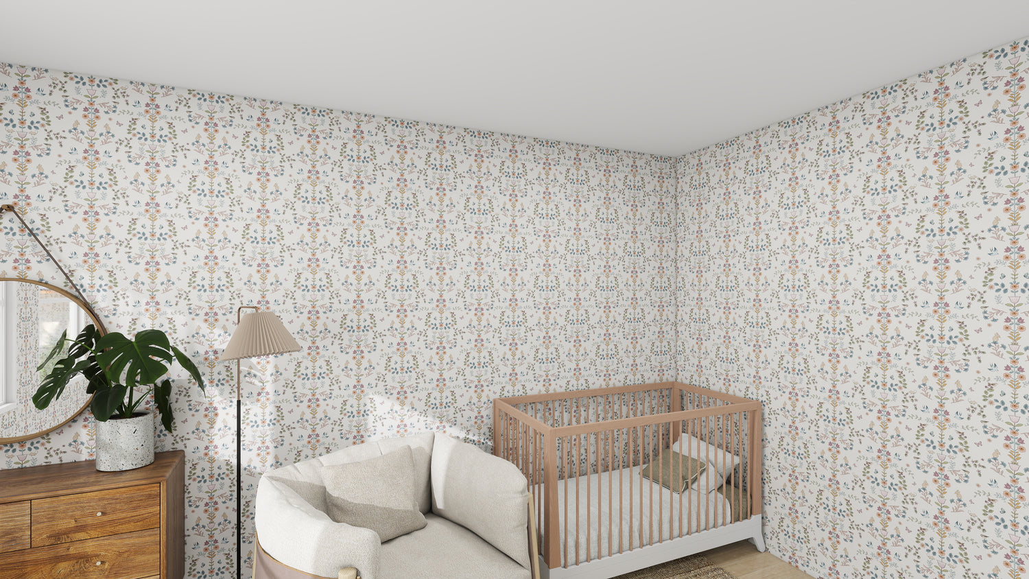 A cozy nursery features munks and mes Forest Tales Wallpaper Repeat Pattern, a light wood crib with a pillow, a cushioned chair, wooden dresser with a round mirror, potted plant, and floor lamp. The nature-inspired design creates an inviting atmosphere.