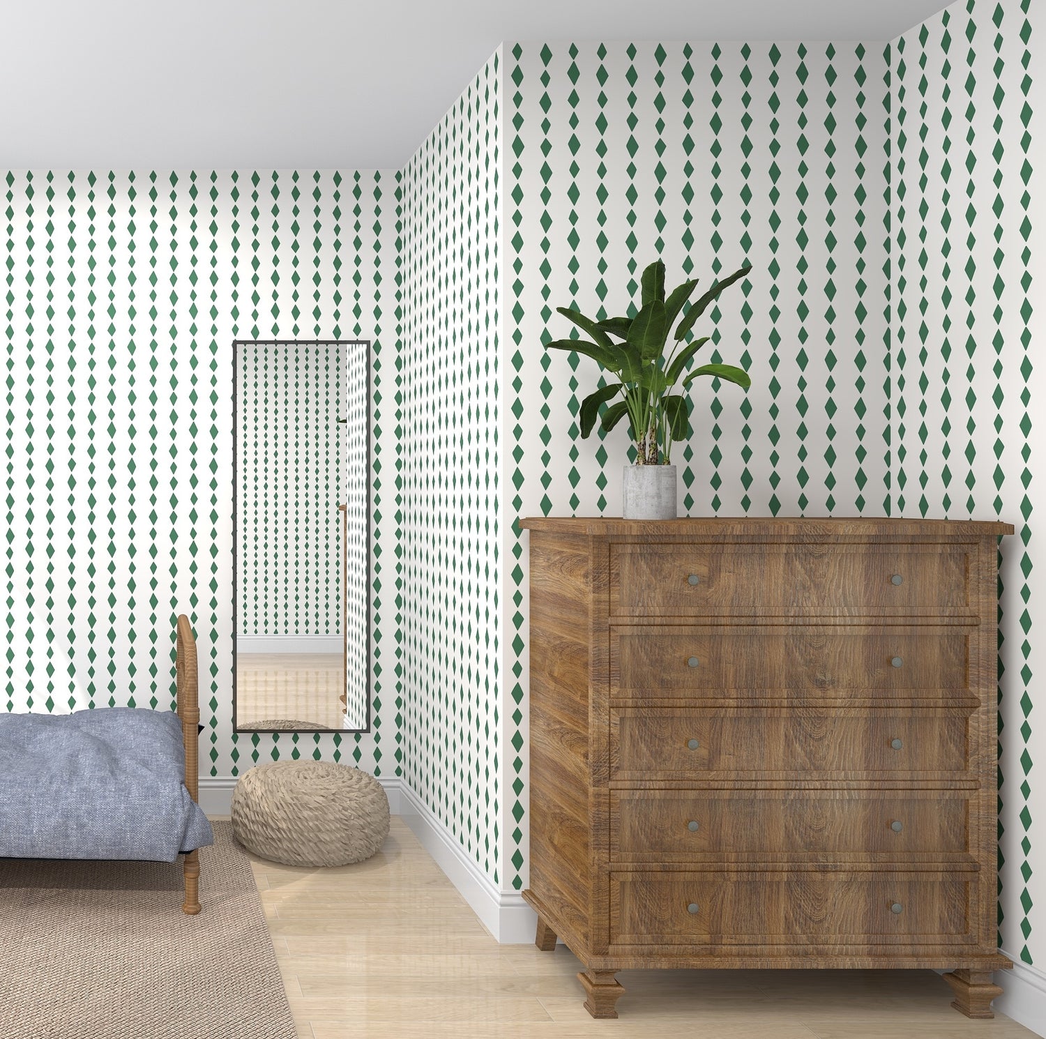 The room showcases the Jolly Jester Wallpaper Repeat Pattern in green by munks and me, complemented by a wooden dresser with a plant. A full-length mirror reflects light onto a small round ottoman and the gray bed nestled in the corner on the light wood floor.